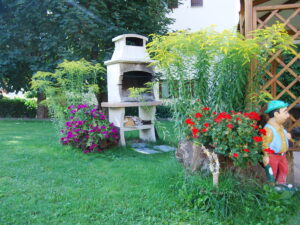 Chalet con giardino e barbecue